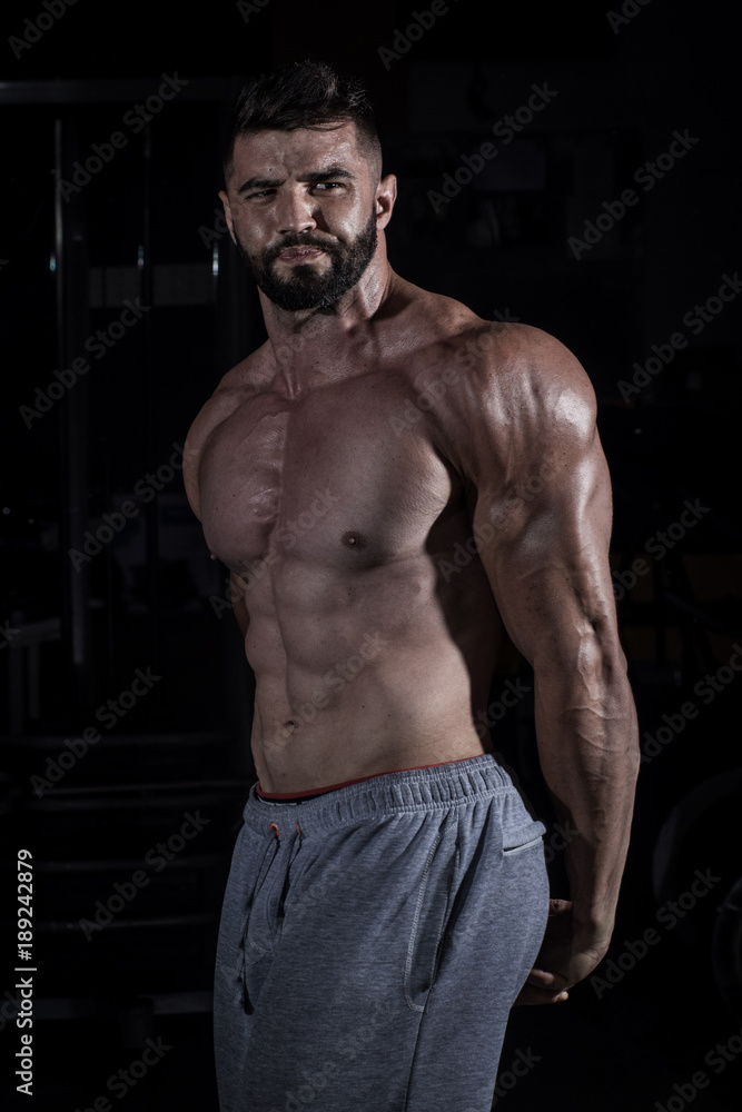 Fototapeta premium Muscle Man in the Gym