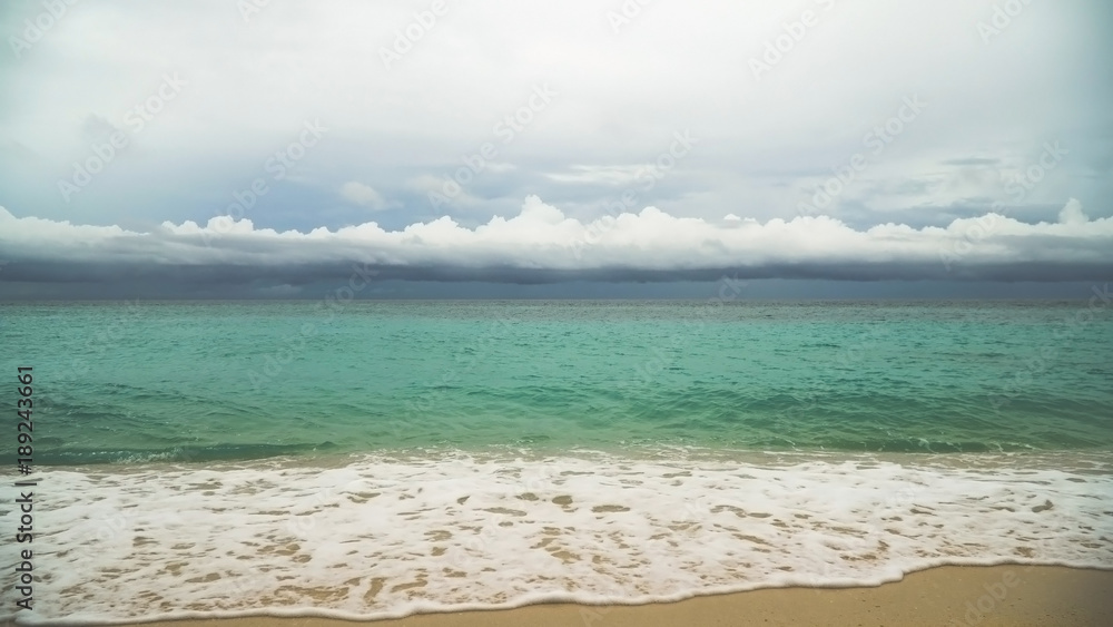 Beautiful tropical island with white sand beach and tourists in stormy weather. Puka shell beach. Tropical lagoon with turquoise water and white sand. Beautiful sky, sea, beach,resort. Beautiful Beautiful tropical island with white sand beach and tourists in stormy weather. Puka shell beach. Tropical lagoon with turquoise water and white sand. Beautiful sky, sea, beach,resort. Beautiful