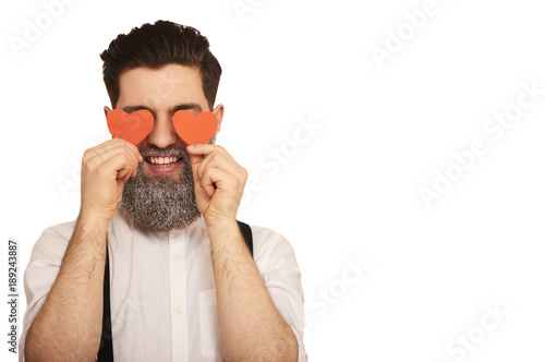 handsome beard man   with red hearts isolated on white