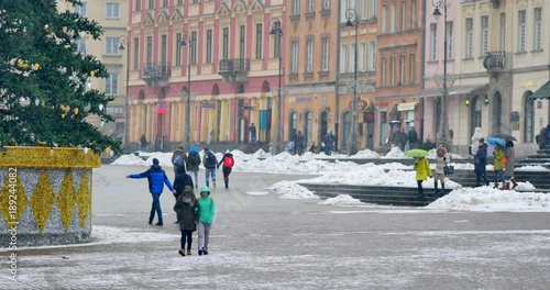 Street decorated for Christmas, Warsaw's Old Town. Unrecognizable people on the Warsaw's Old Town.