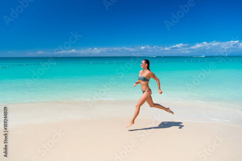 Girl or woman in sexy bikini run in antigua © be free