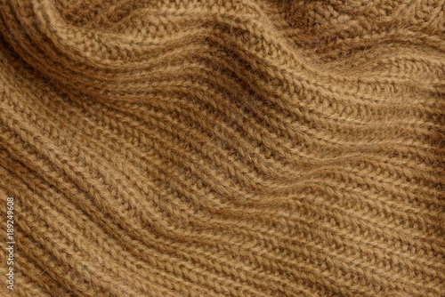 коричневая текстура из части старого шерстяного свитера
