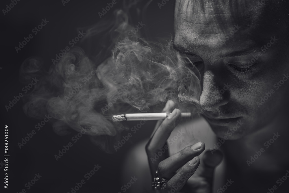 Fototapeta premium Smoking and thoughtful man