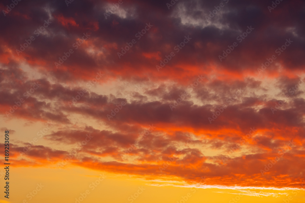 Fototapeta premium Fiery, orange and red colors sunset sky as background