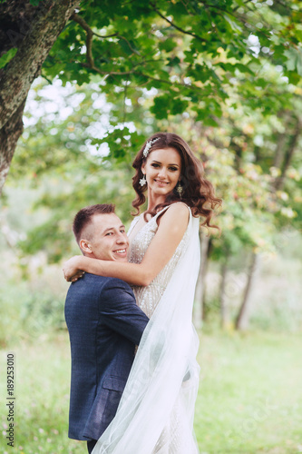 Wedding walk on nature. Happy bride and groom after wedding ceremony