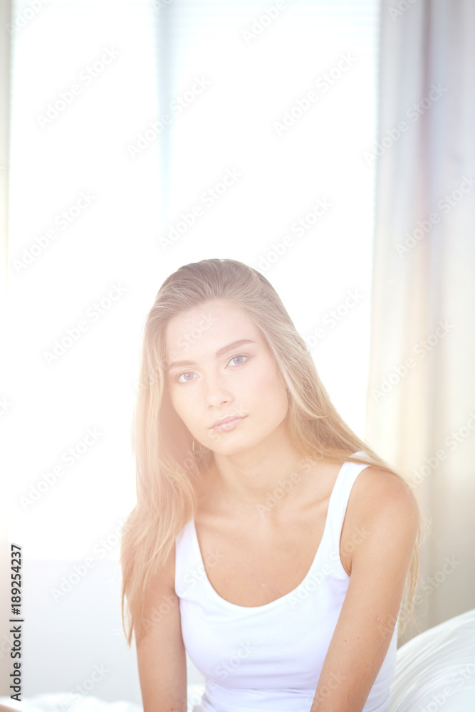 Beautiful woman showing heart shape on her hand , sitting bed. Beautiful woman Beautiful woman showing heart shape on her hand , sitting bed. Beautiful woman