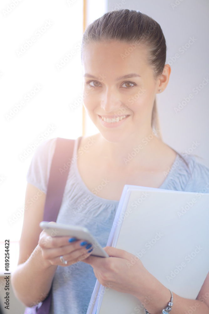 Woman use of mobile phone in university. Student woman Woman use of mobile phone in university. Student woman