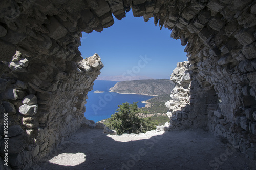 The castle of Monolithos, ruins medieval castle on the top of the rock, hole in the rock, Rhodes, Greece