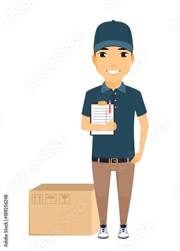 The concept of mail delivery. A young postman stands next to a box and holding a tablet. Smiles. The working uniform. In flat style on white background. Cartoon. © Denis