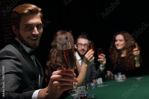 poker player with a glass of wine