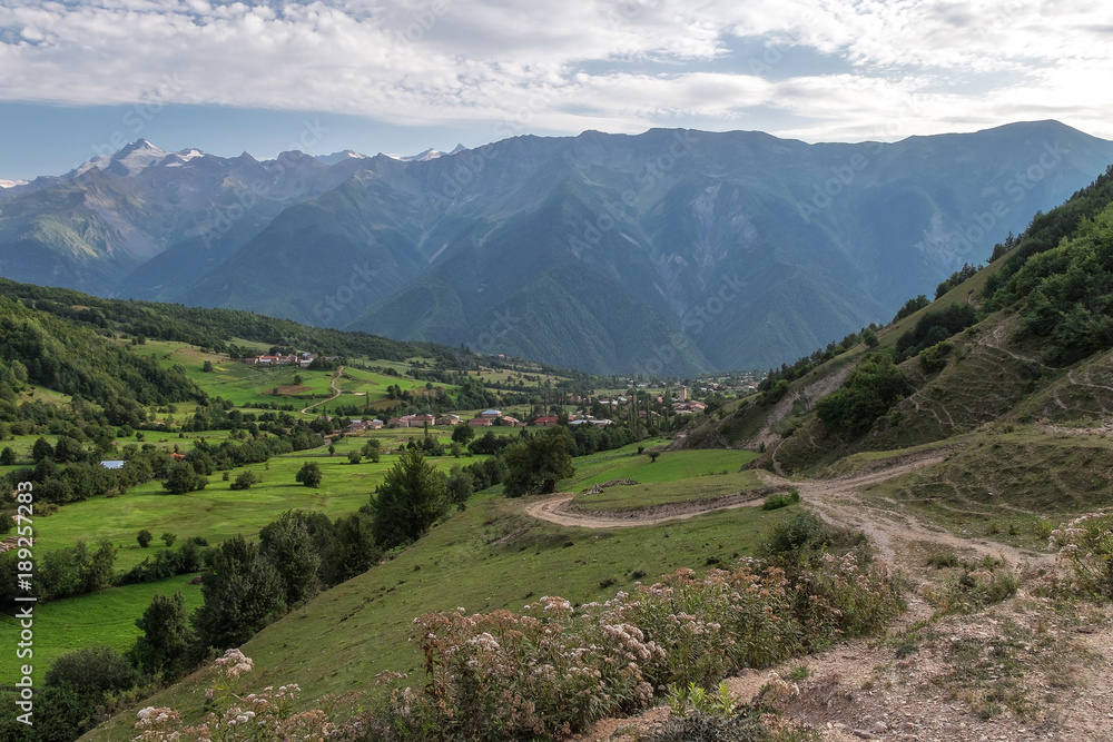 Svaneti village under huge mountais