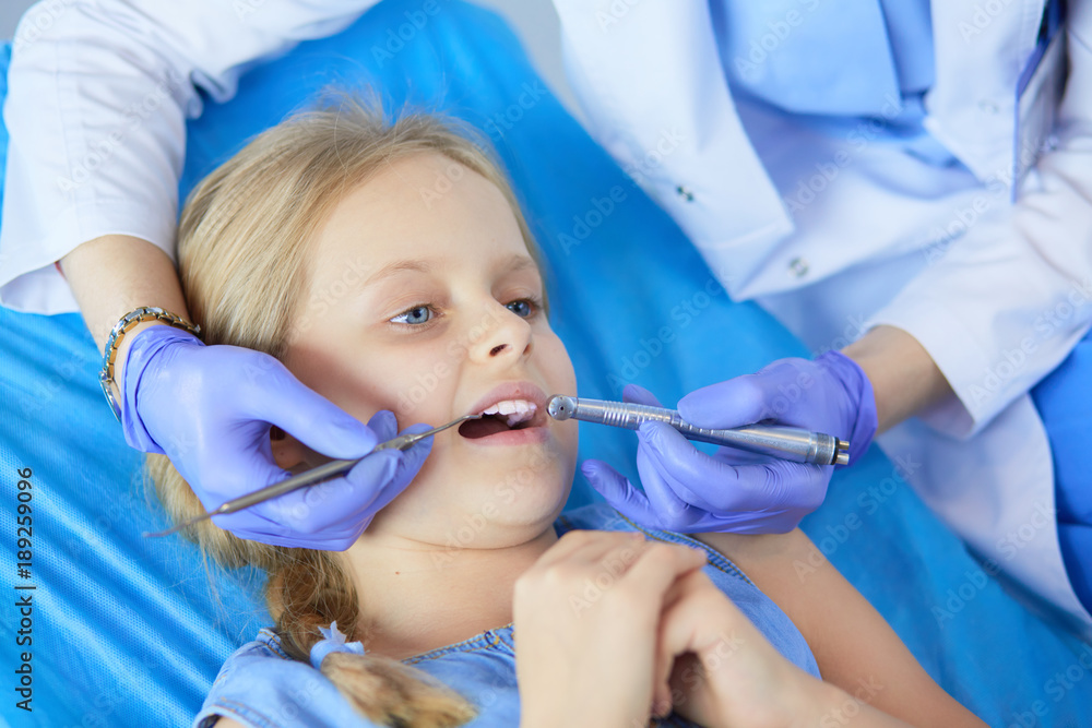 Little girl sitting in the dentists office Little girl sitting in the dentists office