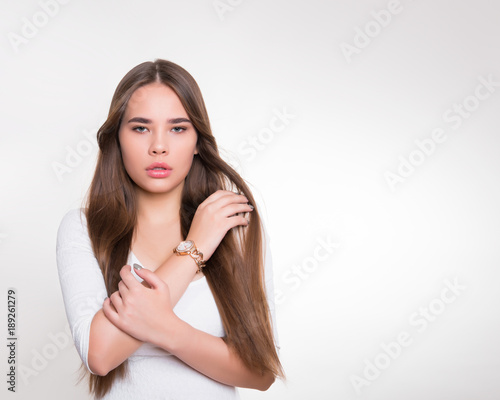 beautiful young woman with long hair wearing wrist watch