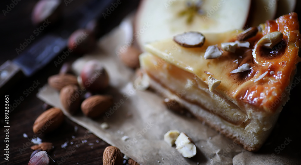 Pie with cinnamon and apples on a wooden table. Fresh pastry wit Pie with cinnamon and apples on a wooden table. Fresh pastry wit