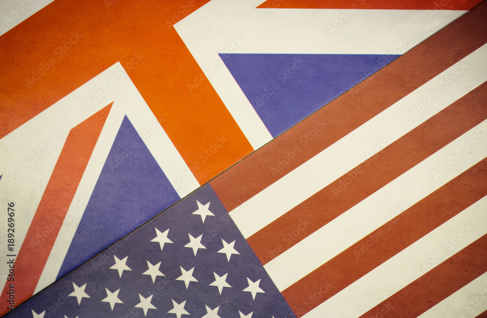 Fototapeta premium The UK and USA Flags on a Distressed Background