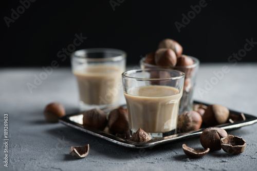 Cream liqueur with hazelnuts, homemade, selective focus, toned image