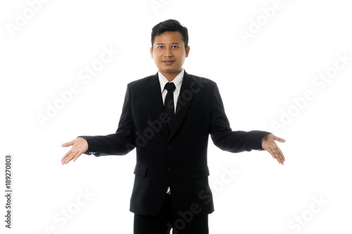 Portrait of an asian business man in a pose I do not know. Isolated on white background