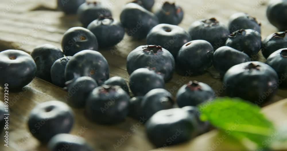 Fresh blueberries and mint on wooden table Fresh blueberries and mint on wooden table