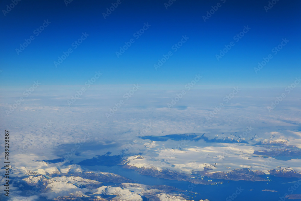 Aerial view of snow and misty horizon winter vacation on white snowy mountains - Trip wander to exclusive luxury destinations Aerial view of snow and misty horizon winter vacation on white snowy mountains - Trip wander to exclusive luxury destinations