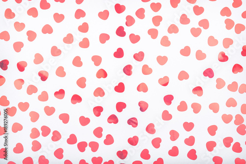 Background with glitter heart confetti. Valentine day concept. Trendy minimalistic flat lay design background