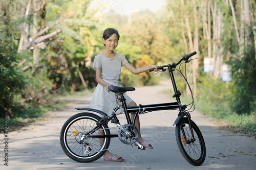 child girl with folding bike