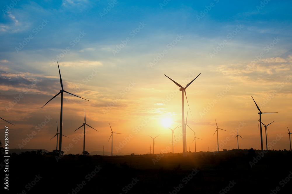 The sun is behind the wind turbine used to generate electricity. Renewable Energy Concepts and Help the World Save Energy The sun is behind the wind turbine used to generate electricity. Renewable Energy Concepts and Help the World Save Energy