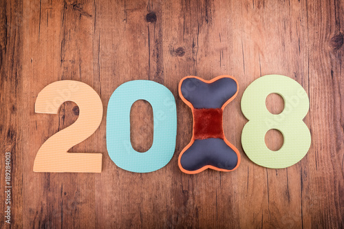 2018 word on wooden background,Year of the dog.