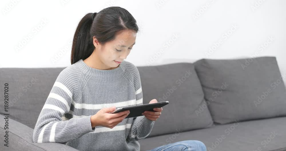 Woman use of tablet computer at home Woman use of tablet computer at home