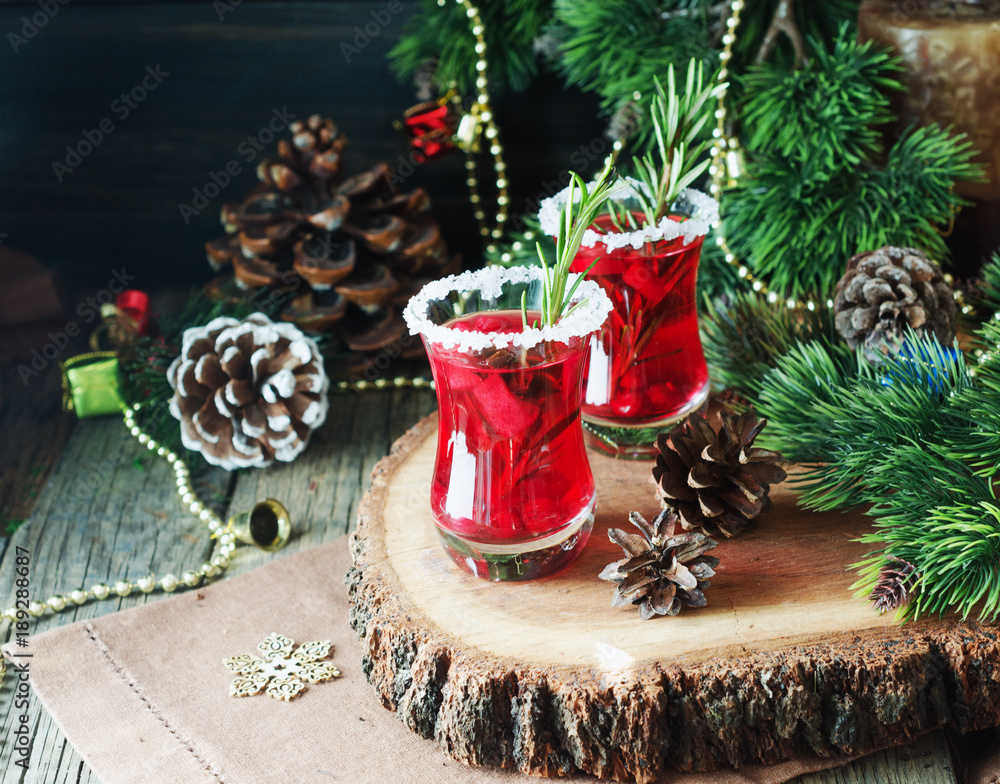 glass of hot mulled wine for the new year with ingredients for cooking, nuts and Christmas decorations glass of hot mulled wine for the new year with ingredients for cooking, nuts and Christmas decorations