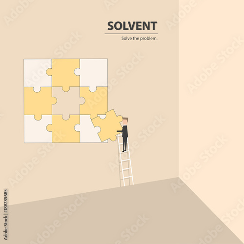 Businessman fulfill the puzzle by pieces together in a logical way, in order to arrive at the correct solution. Business concept of success, solution, management and decision.