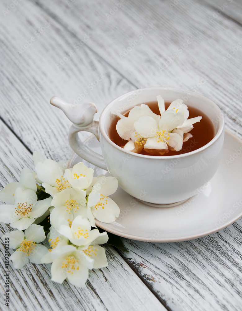Cup of tea with jasmine flowers Cup of tea with jasmine flowers