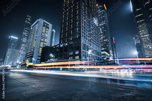 Fototapeta Naklejka Na Ścianę i Meble -  the light trails on the modern building background.
