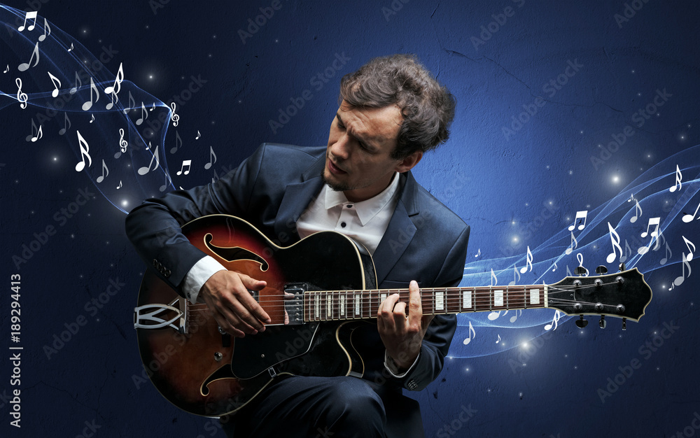 Obraz premium Lonely composer playing on guitar