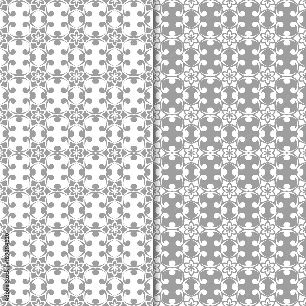 White and gray set of floral backgrounds. Seamless patterns White and gray set of floral backgrounds. Seamless patterns