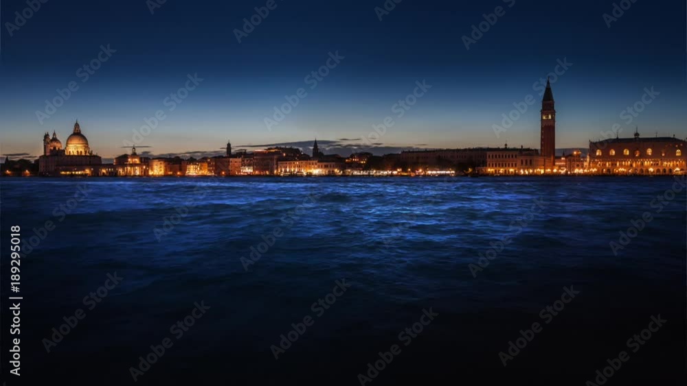 Night panoramic view of illuminated Venice and waving sea. Looping cinemagraph. Night panoramic view of illuminated Venice and waving sea. Looping cinemagraph.