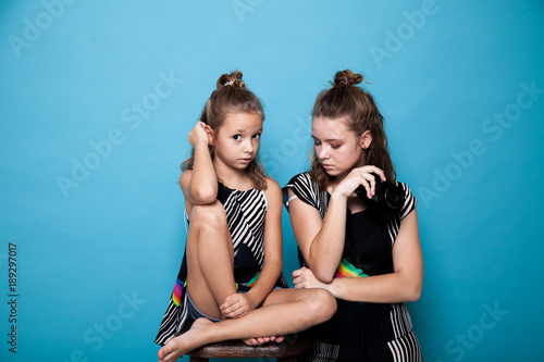 two stylish girls photographed retro camera photo