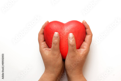 Female hands giving red heart isolated on white background