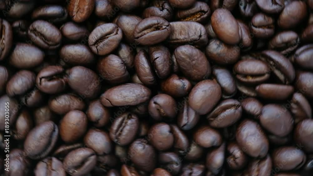 Raw coffee beans on rotating stand, closeup Raw coffee beans on rotating stand, closeup