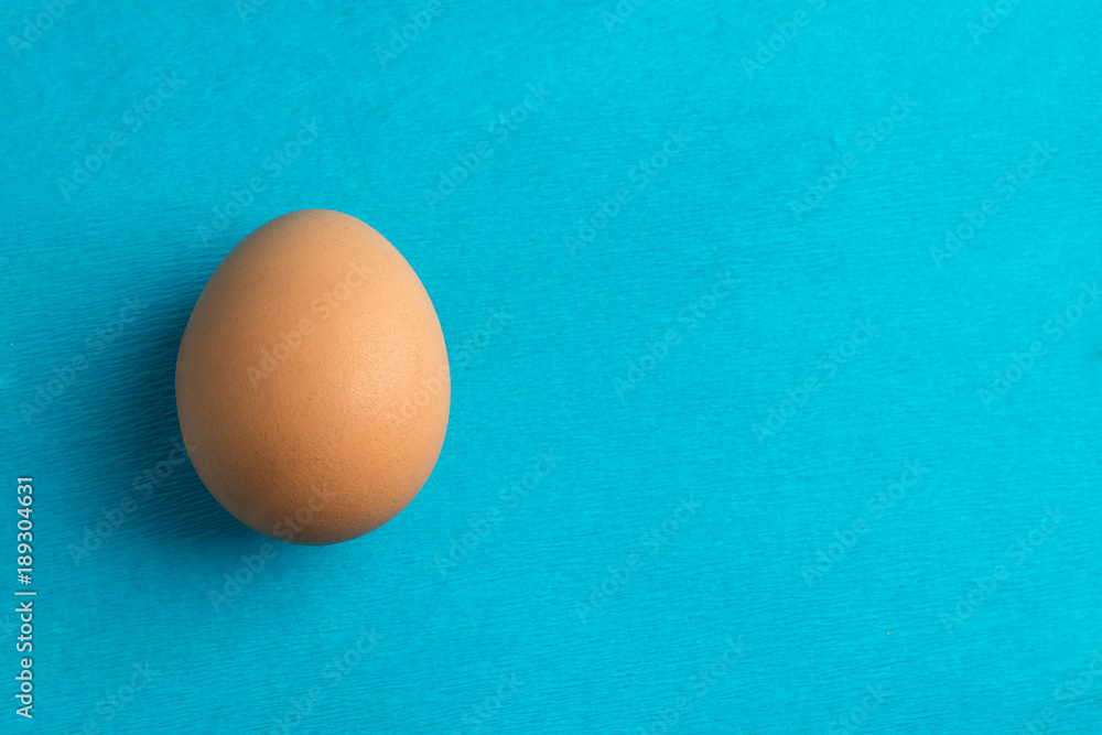 red, chicken egg on a blue background red, chicken egg on a blue background