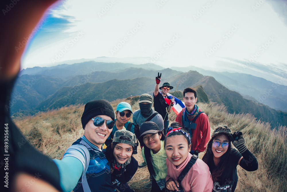 Friends Taking Selfie at the top of mountain - obrazy, fototapety, plakaty 