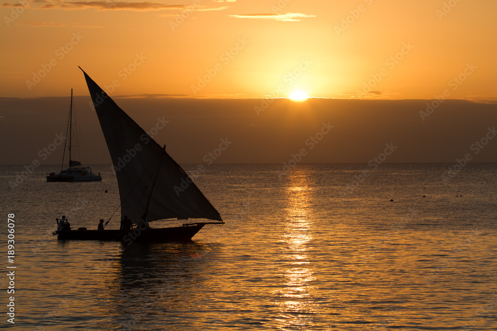 the beautiful beach and sea of zanzibar during the sunset in the indian ocean