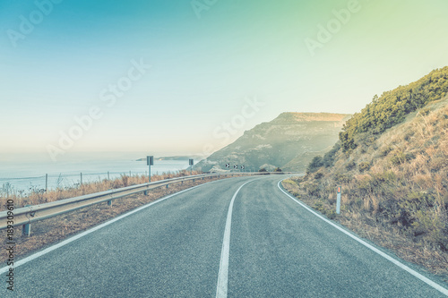 Road by the sea with blue sky
