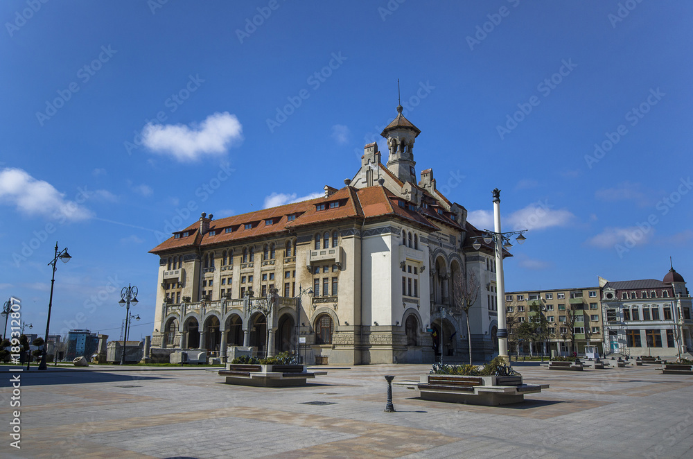 Fototapeta premium Ovidiu Square with National History and Archeology Museum in the Old Town of Constanta, Romania