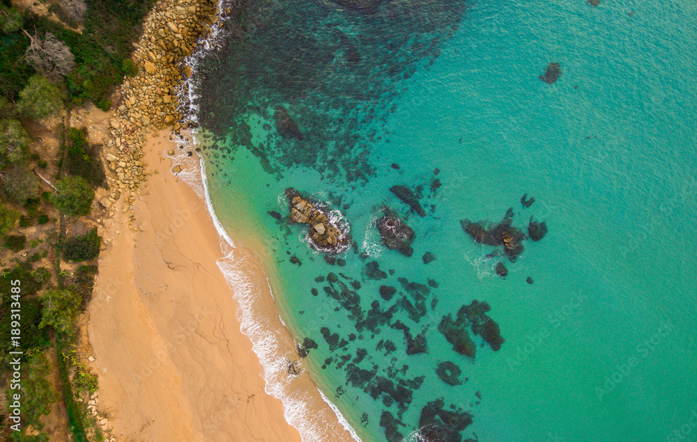 Aerial views of the beach and the waves in the Mediterranean.