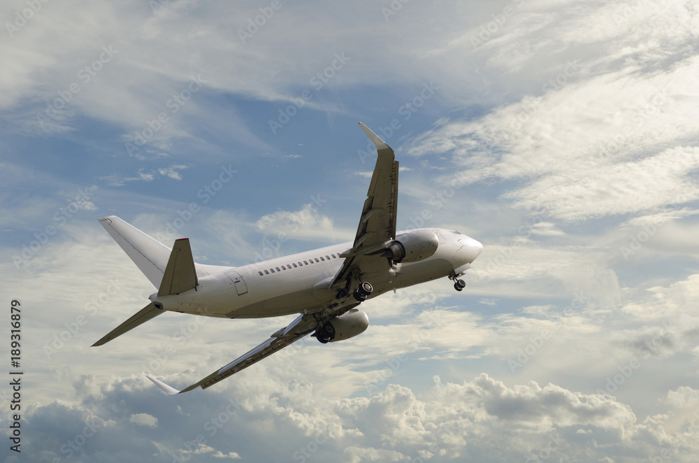 Airplane flying in sky with clouds at sunset time Airplane flying in sky with clouds at sunset time