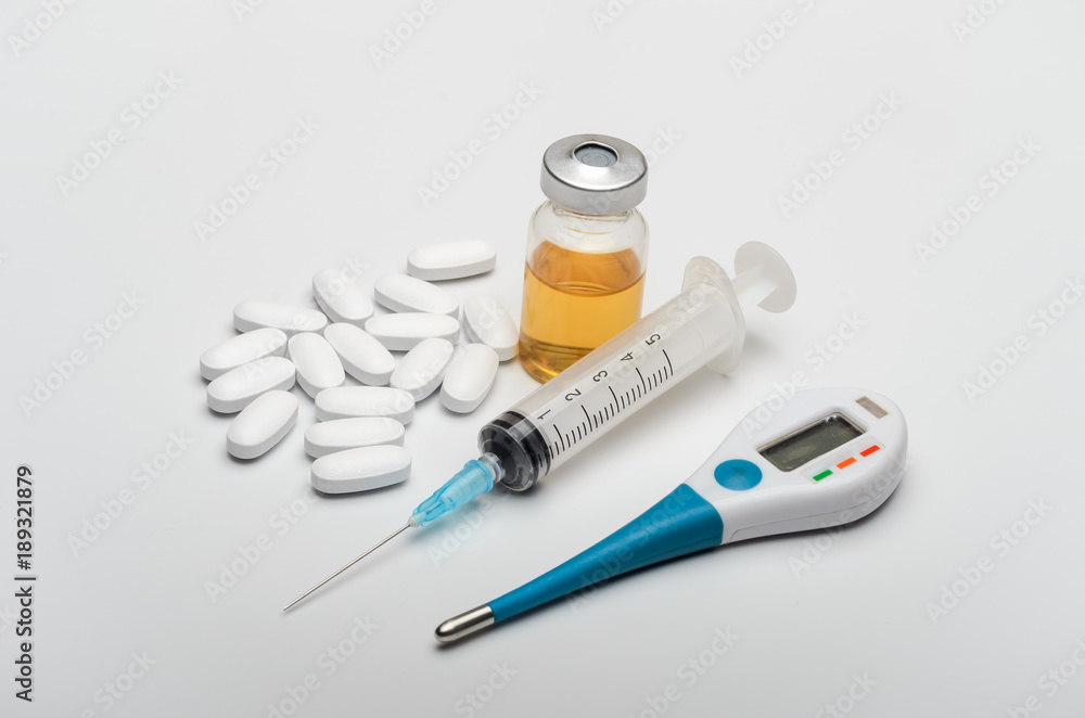 Drugs with a thermometer, tablets and a syringe for injections from viral diseases Drugs with a thermometer, tablets and a syringe for injections from viral diseases