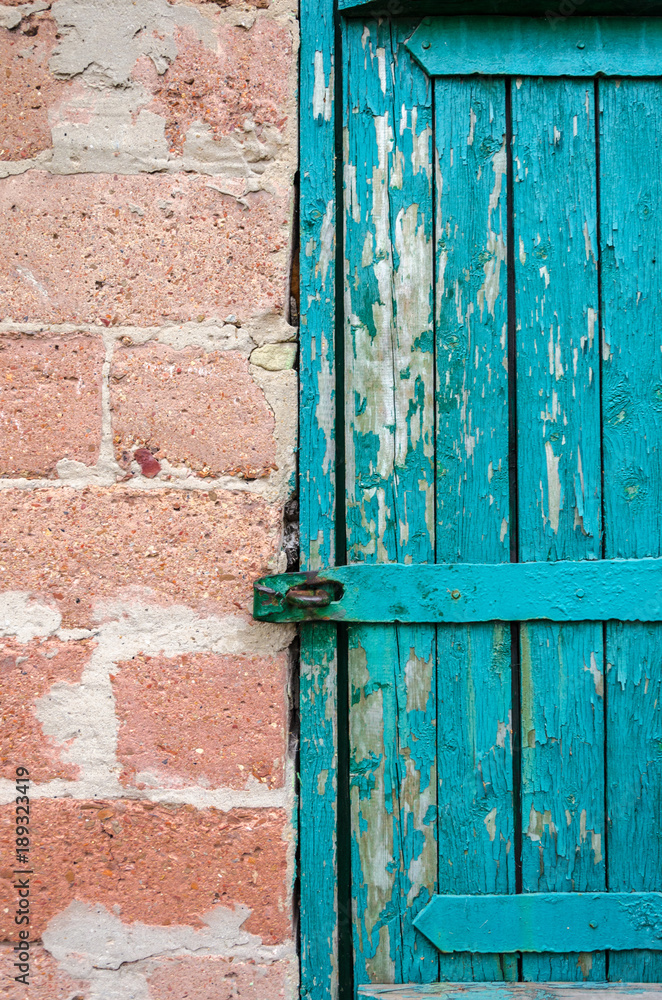 Old peeling green wooden door