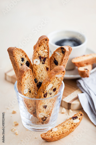 Принти на полотні Italian cranberry almond biscotti  and cup of coffee on background