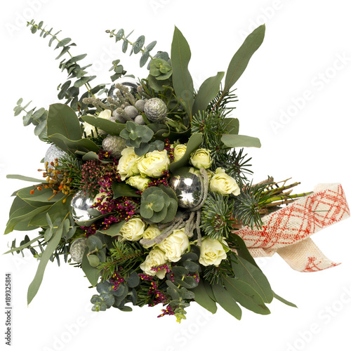 A bouquet of flowers christmas candle wreath in a beautiful packaging, assembled by a florist