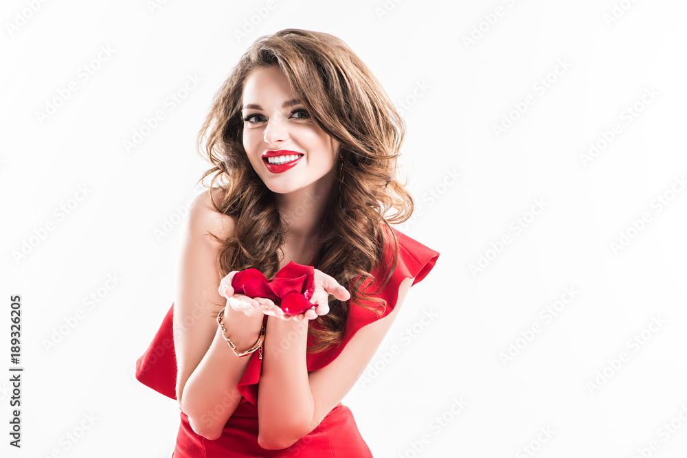 smiling attractive girl showing red rose petals in hands isolated on white smiling attractive girl showing red rose petals in hands isolated on white